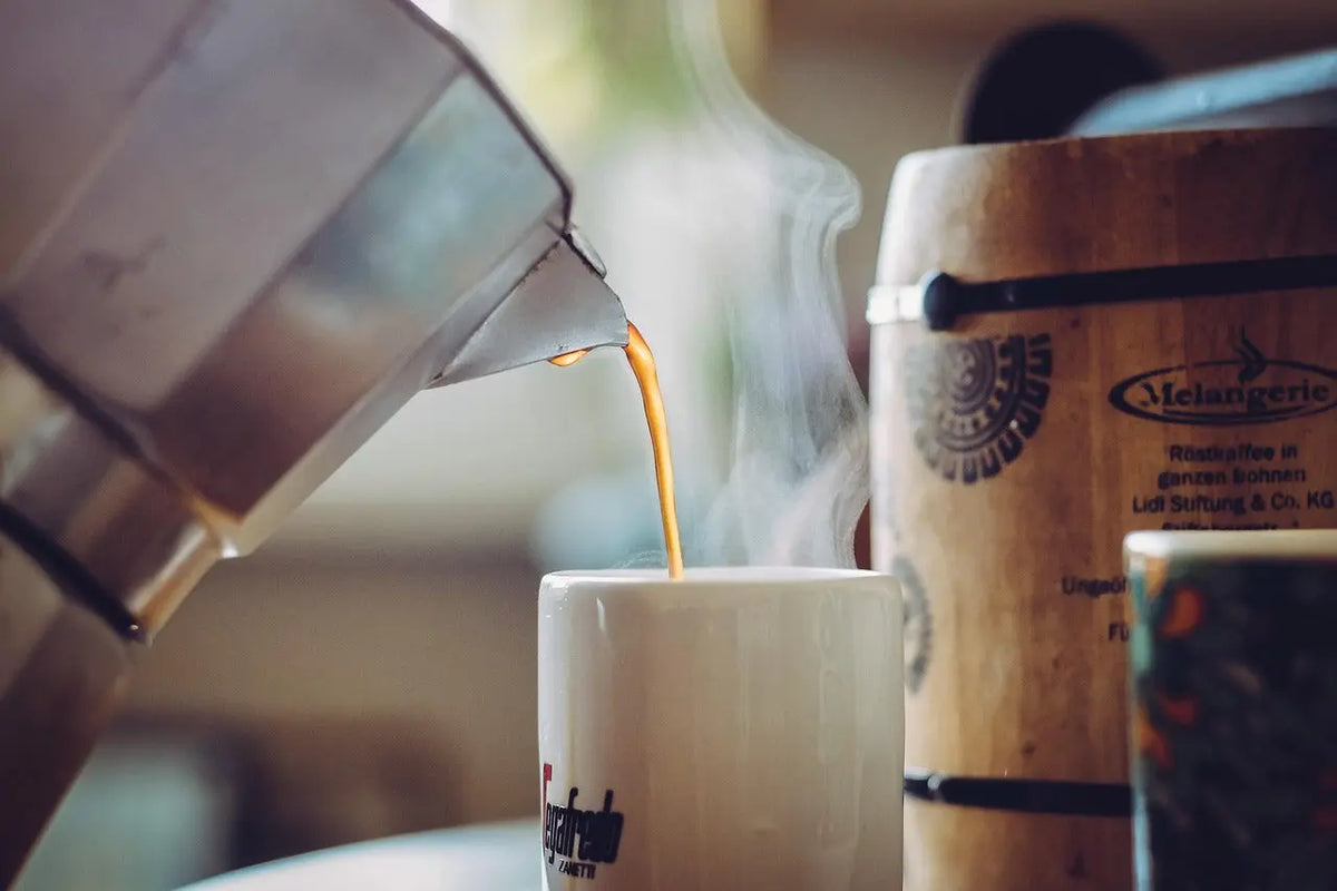 coffee being poured into cup
