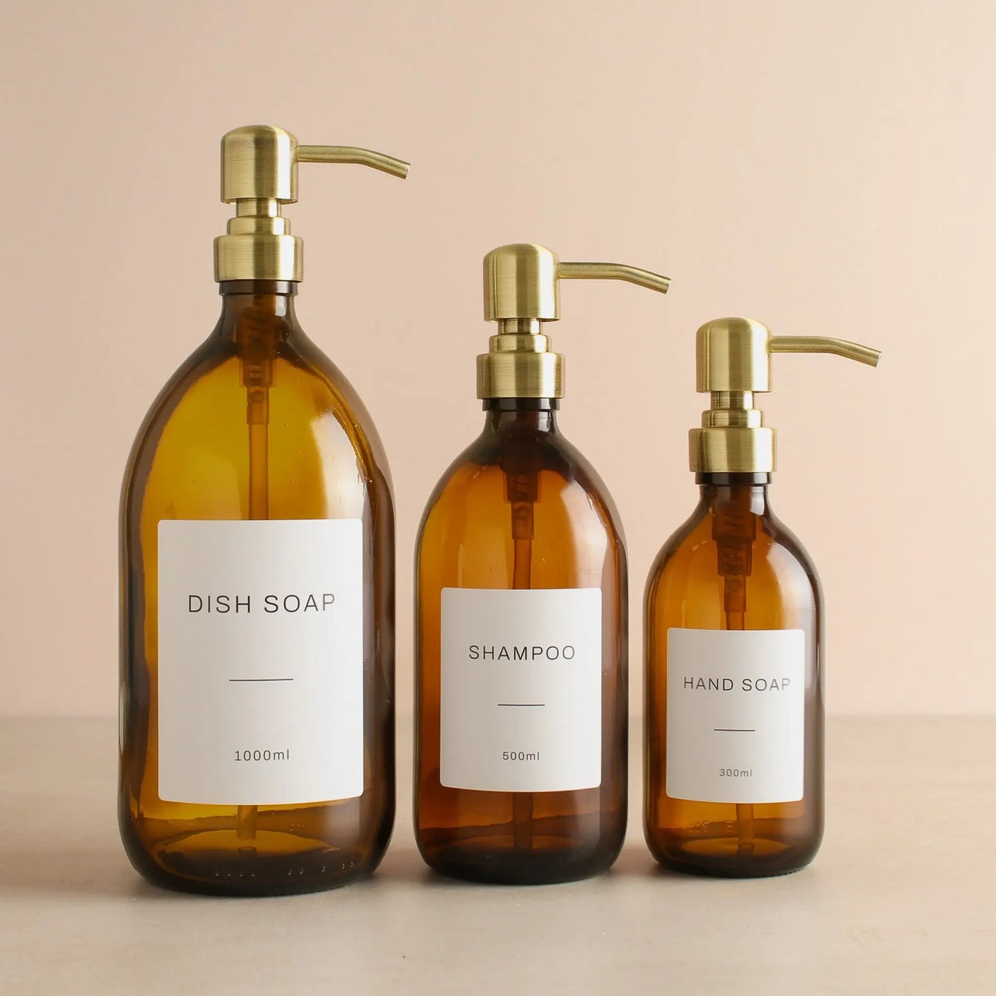 Labelled Amber Glass Dispenser Bottle With Gold Pump Namie Home