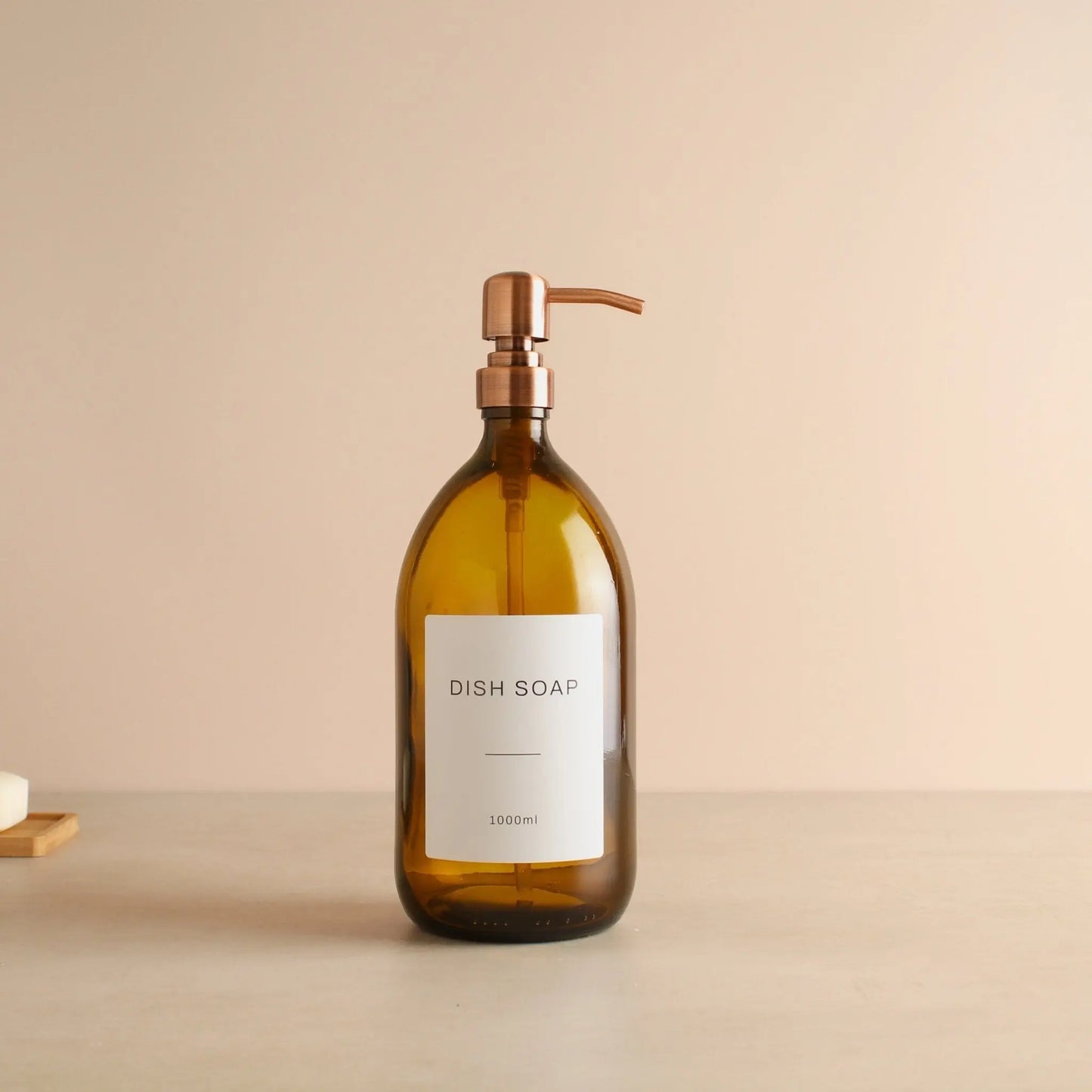 Labelled Amber Glass Dispenser Bottle With Rose Gold Pump Namie Home