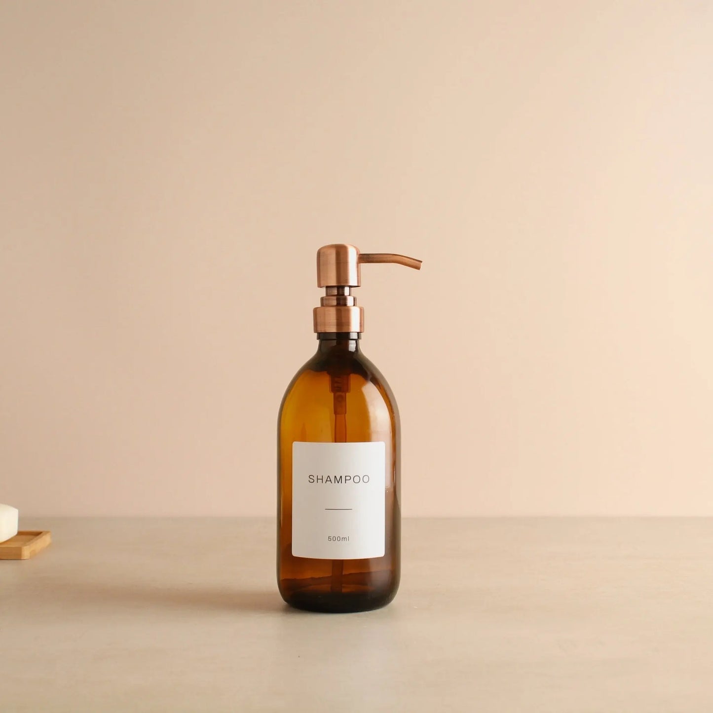 Labelled Amber Glass Dispenser Bottle With Rose Gold Pump Namie Home