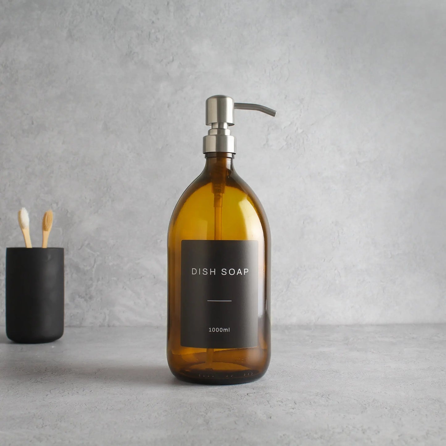 Labelled Amber Glass Dispenser Bottle With Silver Pump Namie Home