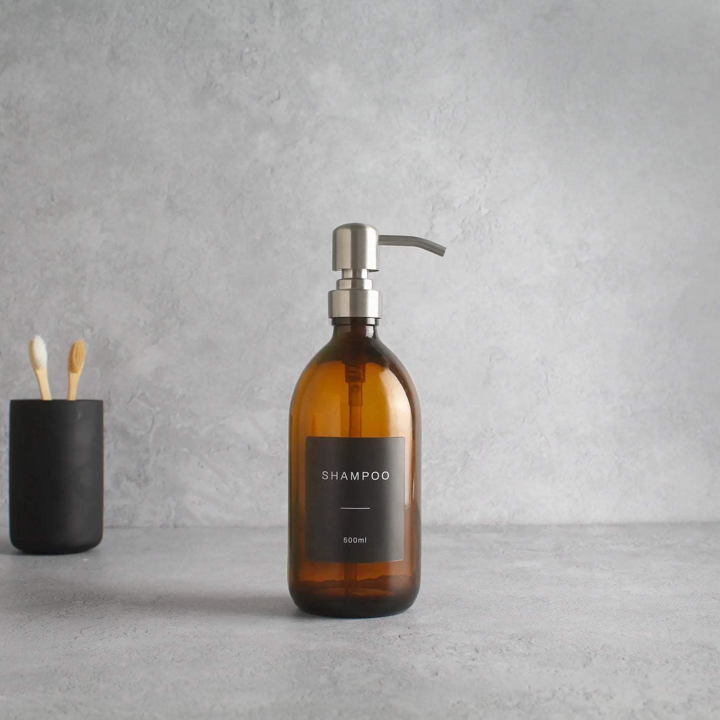 Labelled Amber Glass Dispenser Bottle With Silver Pump Namie Home
