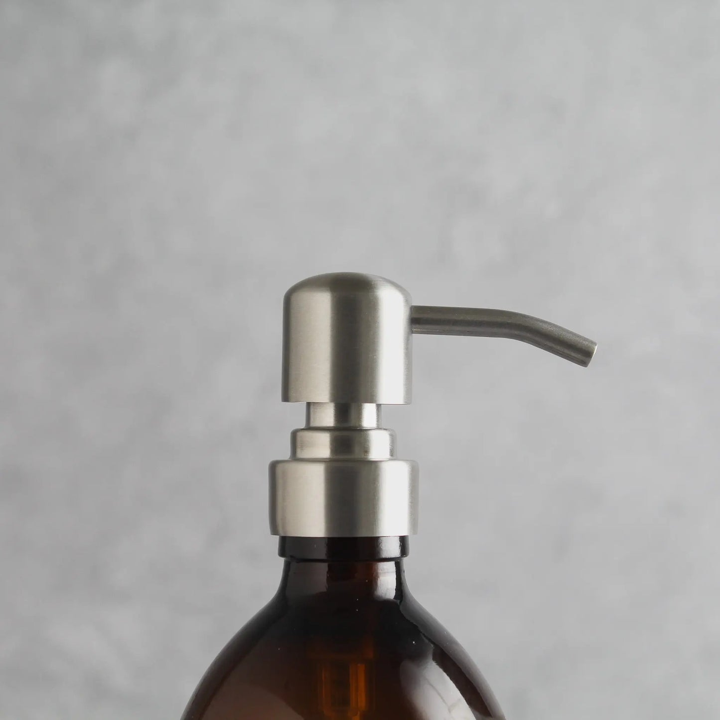 Labelled Amber Glass Dispenser Bottle With Silver Pump Namie Home