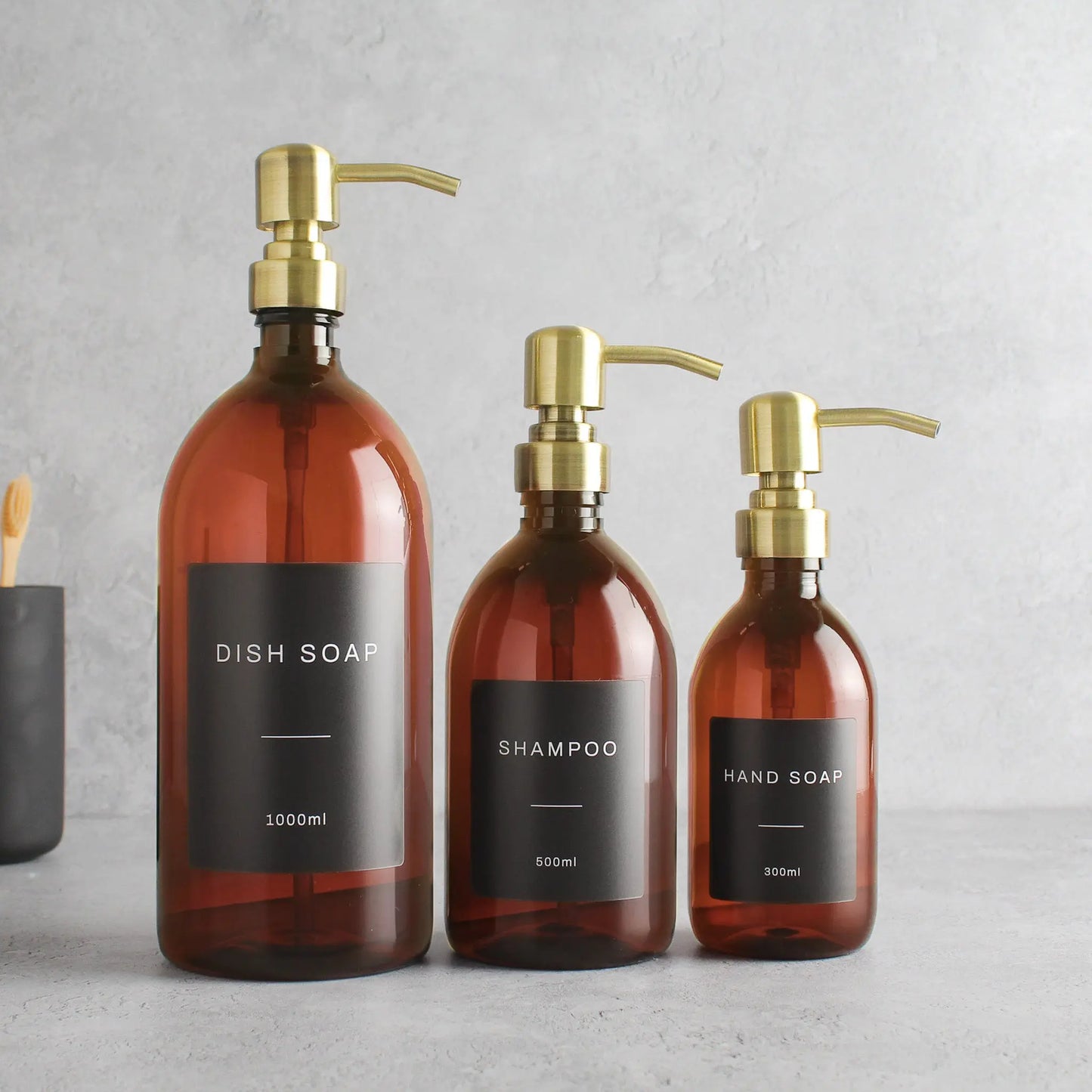 Labelled Amber Plastic Dispenser Bottle With Gold Pump Namie Home