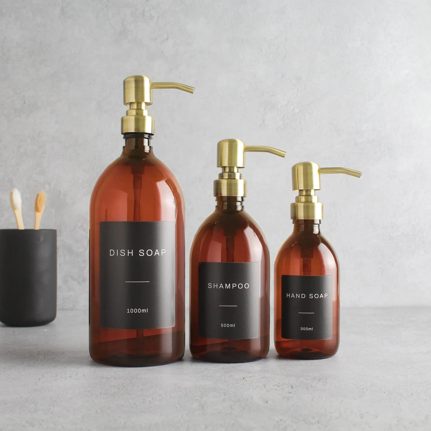 Labelled Amber Plastic Dispenser Bottle With Gold Pump Namie Home