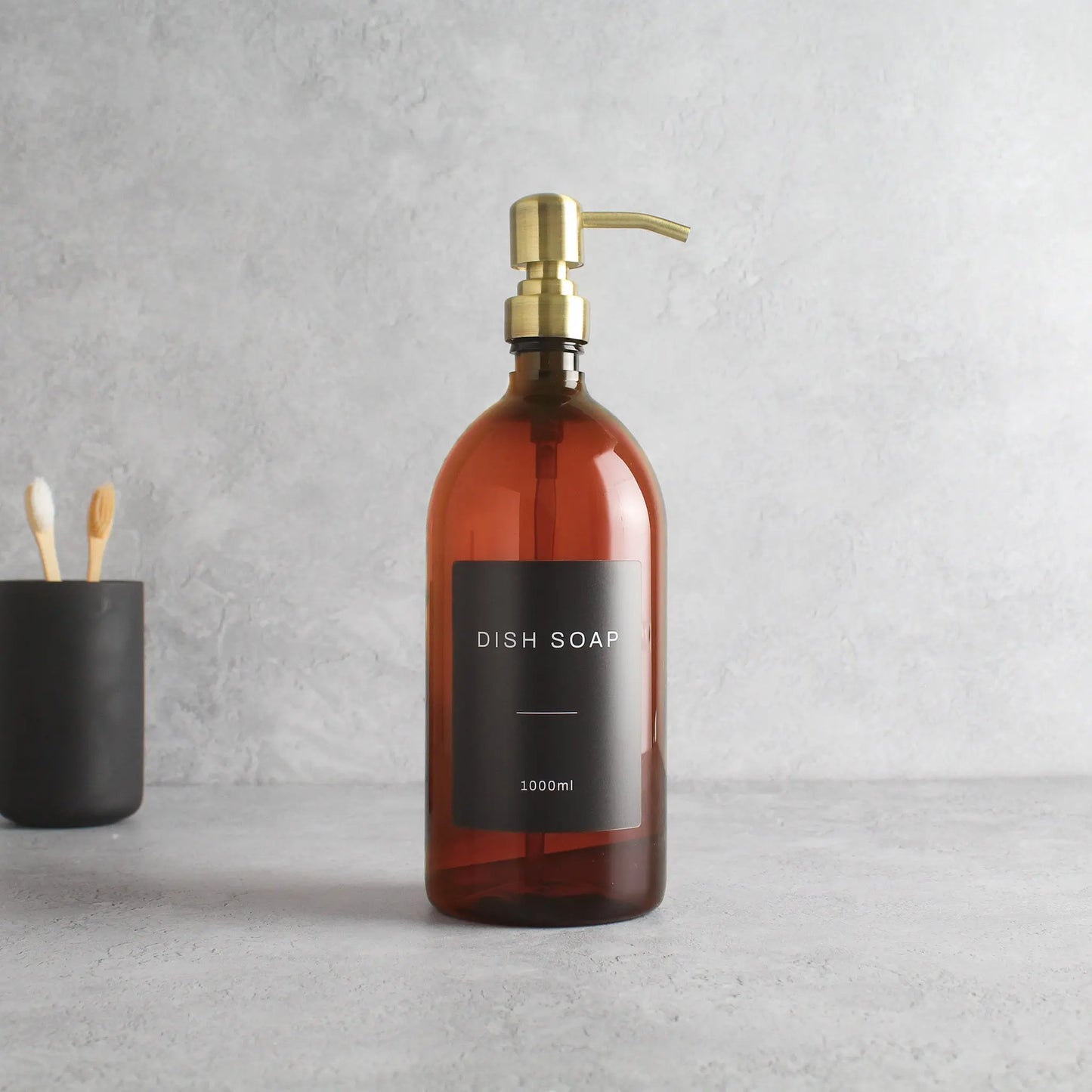 Labelled Amber Plastic Dispenser Bottle With Gold Pump Namie Home