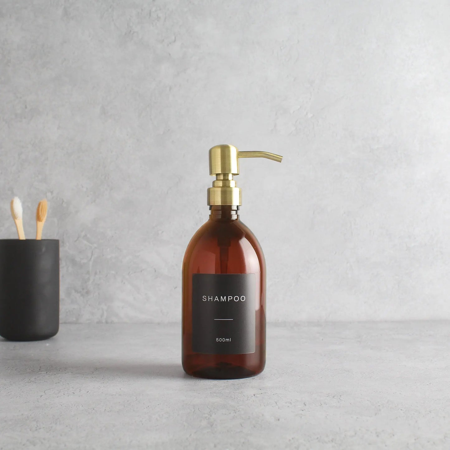 Labelled Amber Plastic Dispenser Bottle With Gold Pump Namie Home