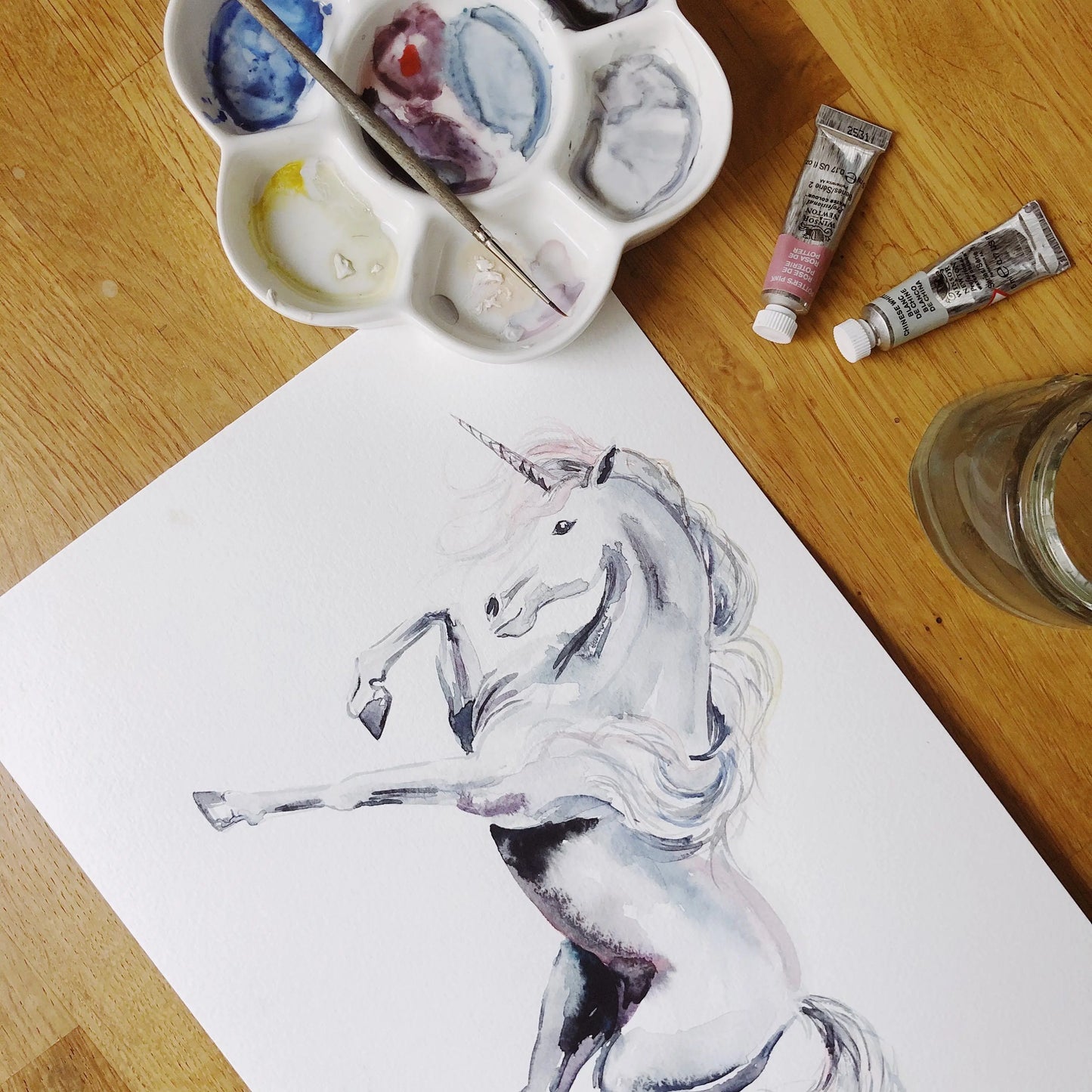 Unicorns and rainbows hand-designed wallpaper Katie Hipwell Design