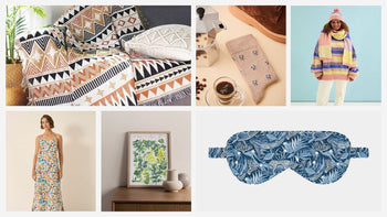 A pile of wrapped Christmas gifts surrounded by fairy lights and tinsel 