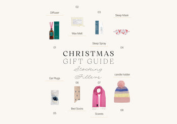 Stocking filler - stockings lined up on fireplace adjacent to Christmas tree