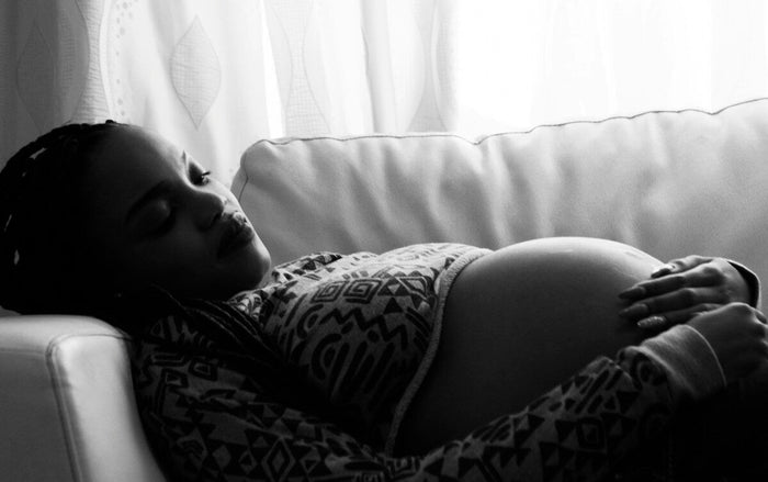 pregnant woman sleeping lying down and relaxing