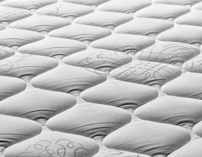 Close-up of grey bare mattress