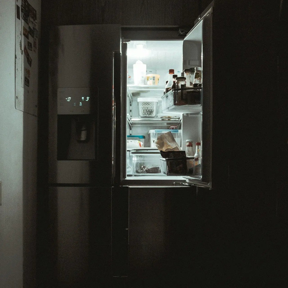 open fridge light in dark room
