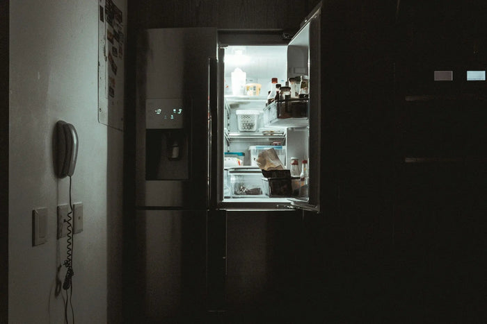 open fridge light in dark room