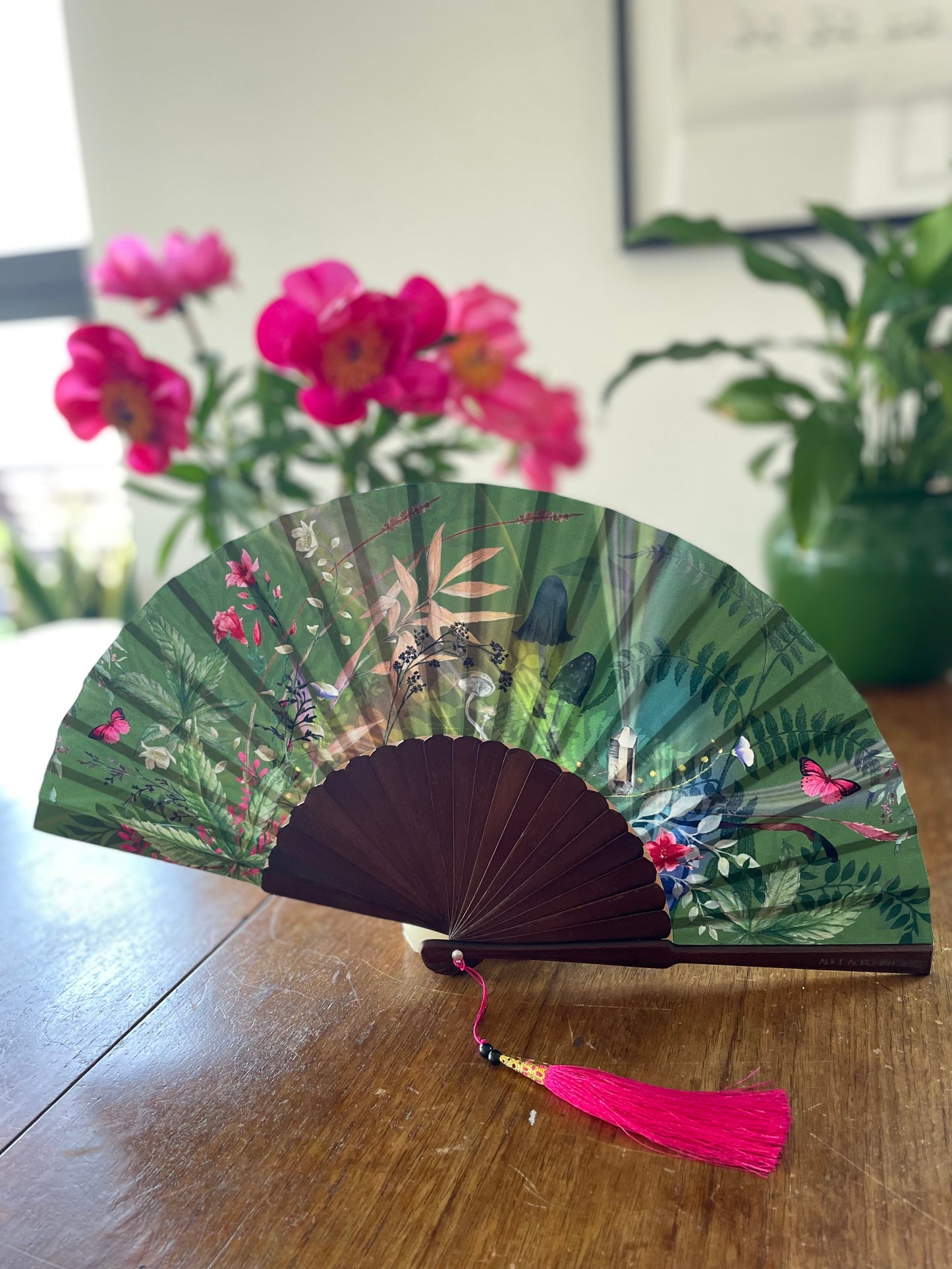 Green hand-held silk fan with 'Greenery' mushroom and crystal botanica ...