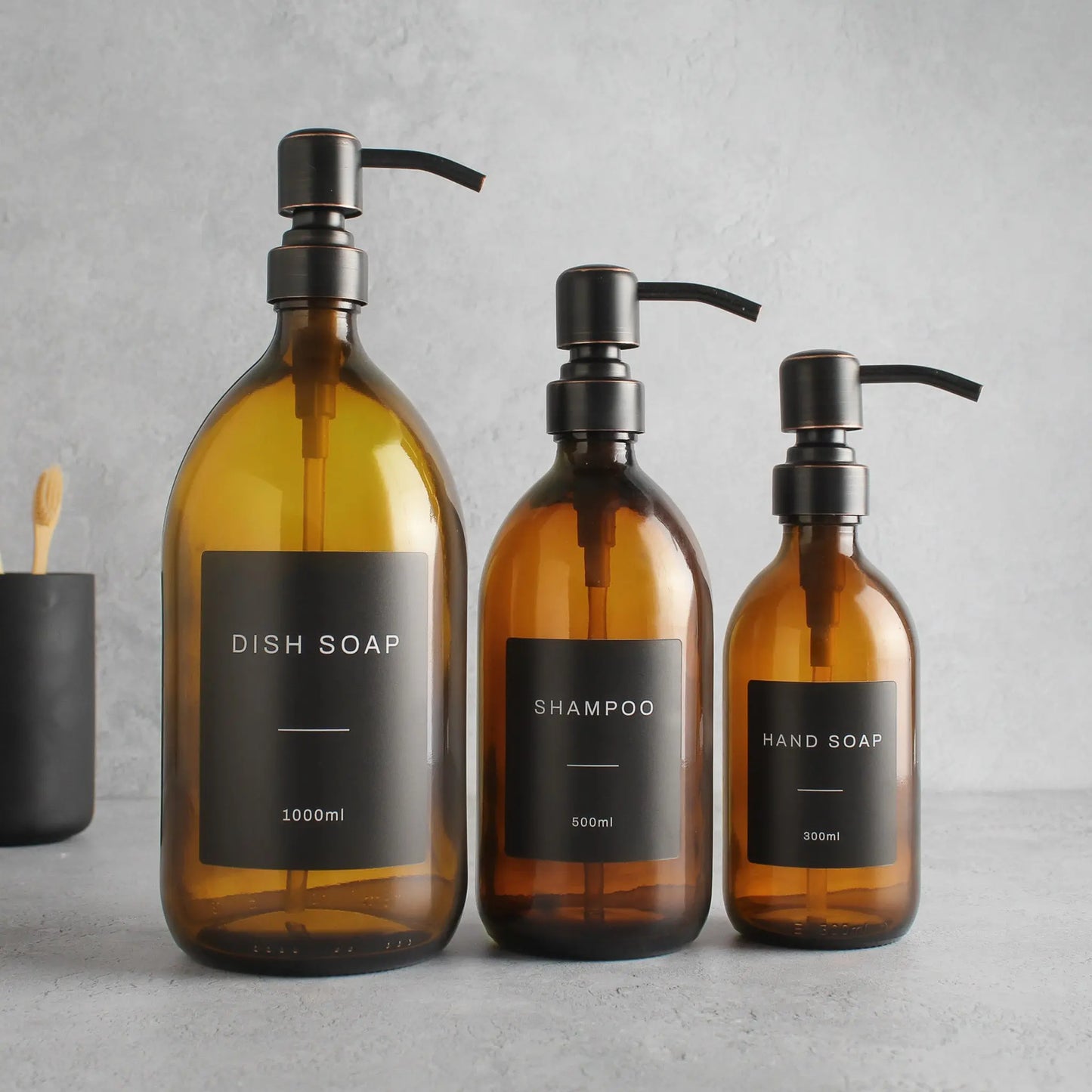 Labelled Amber Glass Dispenser Bottle With Black/Copper Pump Namie Home