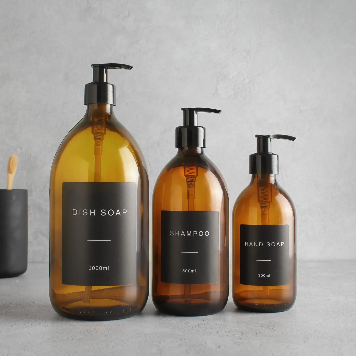 Labelled Amber Glass Dispenser Bottle With Black Pump Namie Home