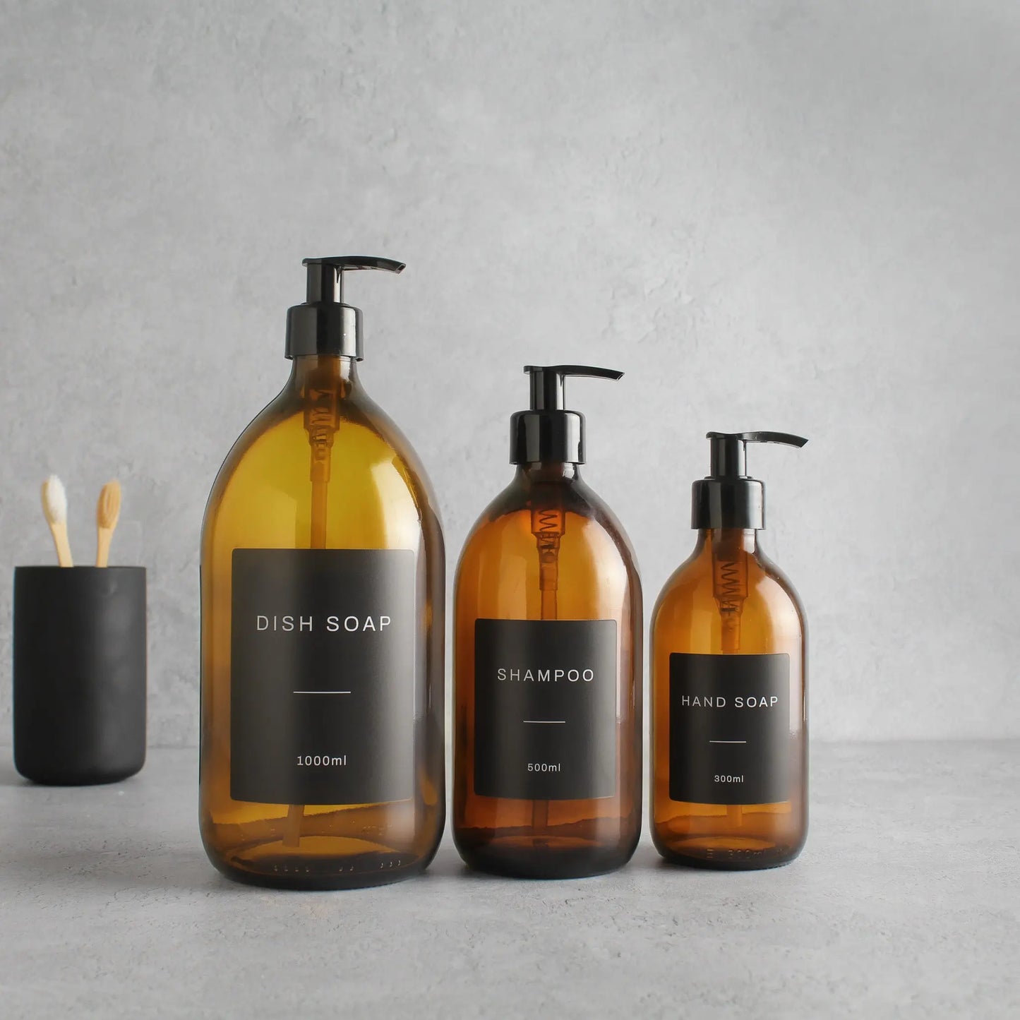 Labelled Amber Glass Dispenser Bottle With Black Pump Namie Home