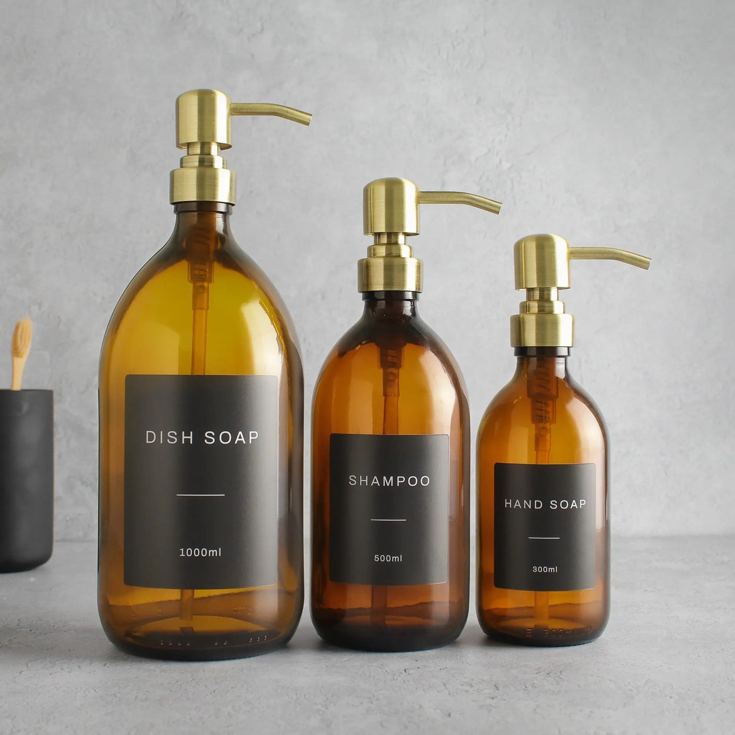 Labelled Amber Glass Dispenser Bottle With Gold Pump Namie Home