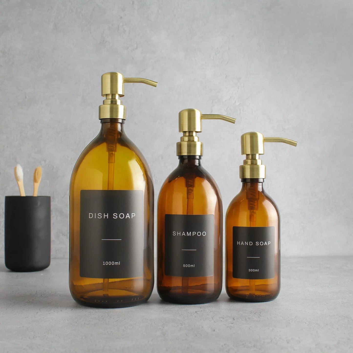 Labelled Amber Glass Dispenser Bottle With Gold Pump Namie Home