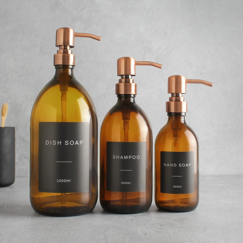 Labelled Amber Glass Dispenser Bottle With Rose Gold Pump Namie Home