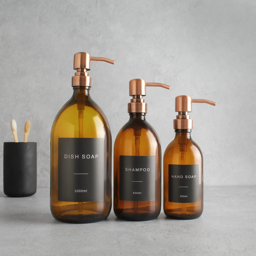 Labelled Amber Glass Dispenser Bottle With Rose Gold Pump Namie Home