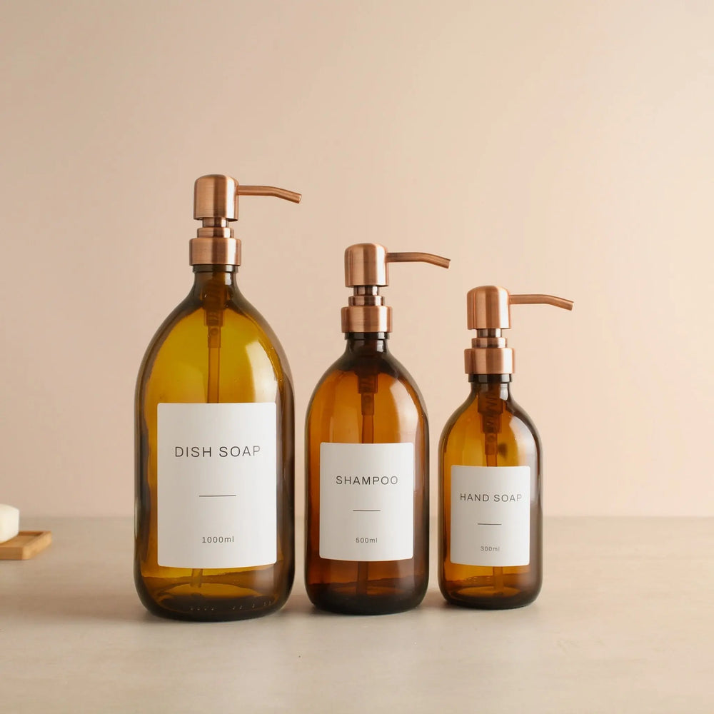 Labelled Amber Glass Dispenser Bottle With Rose Gold Pump Namie Home