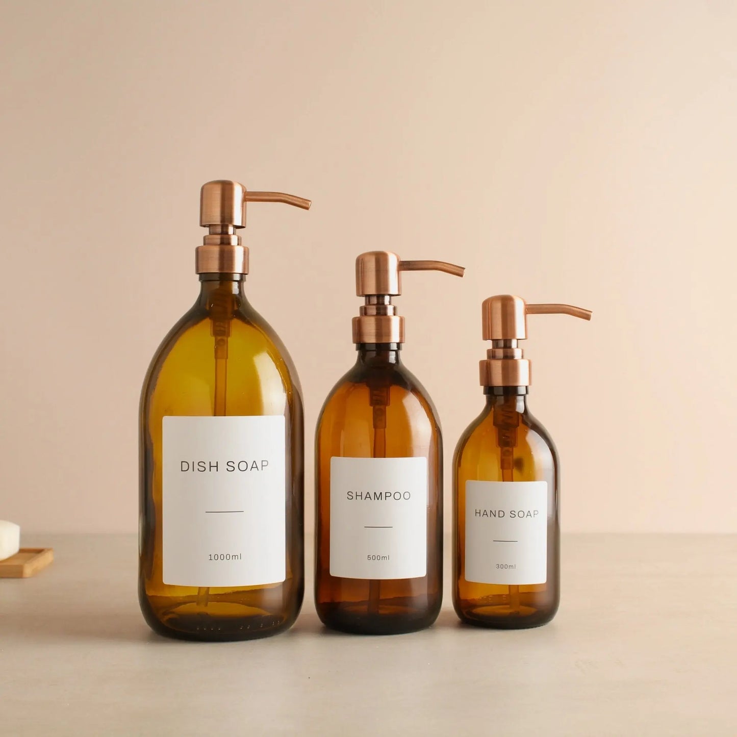 Labelled Amber Glass Dispenser Bottle With Rose Gold Pump Namie Home