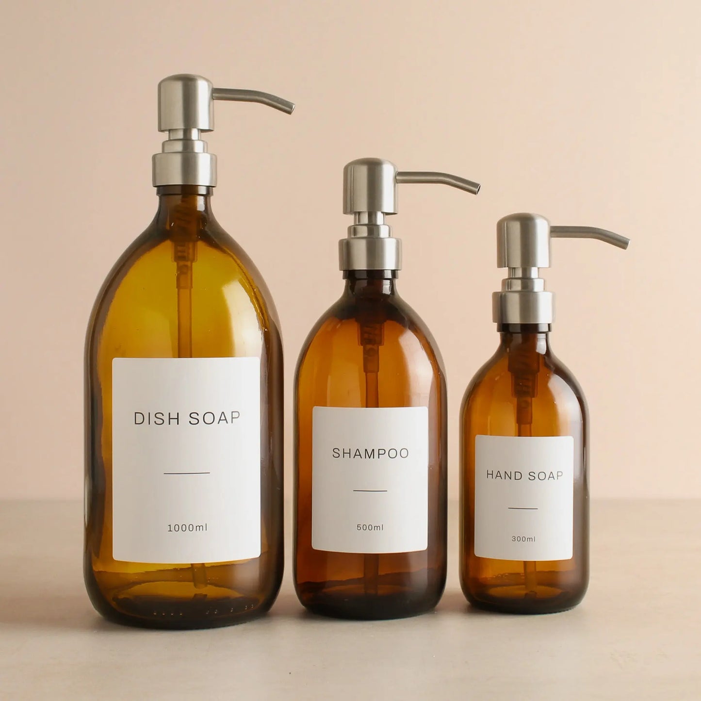 Labelled Amber Glass Dispenser Bottle With Silver Pump Namie Home