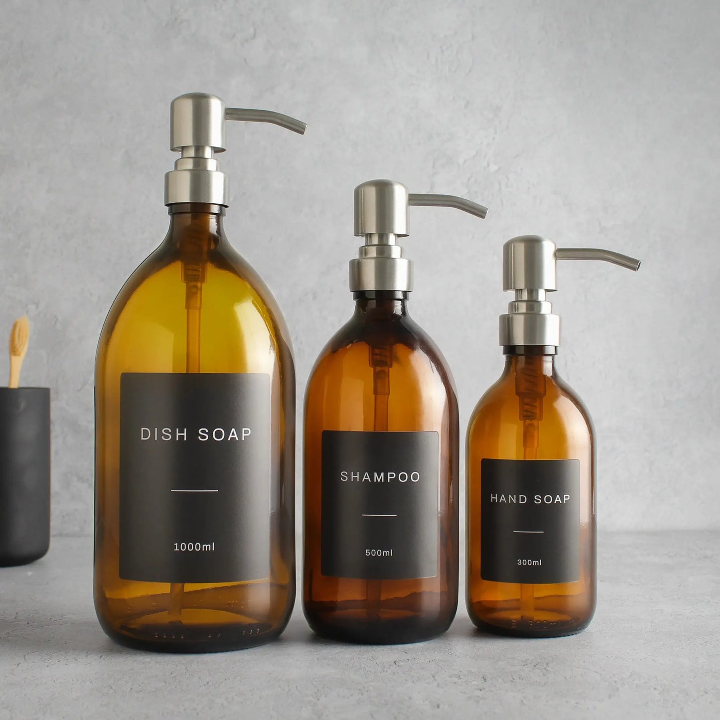 Labelled Amber Glass Dispenser Bottle With Silver Pump Namie Home