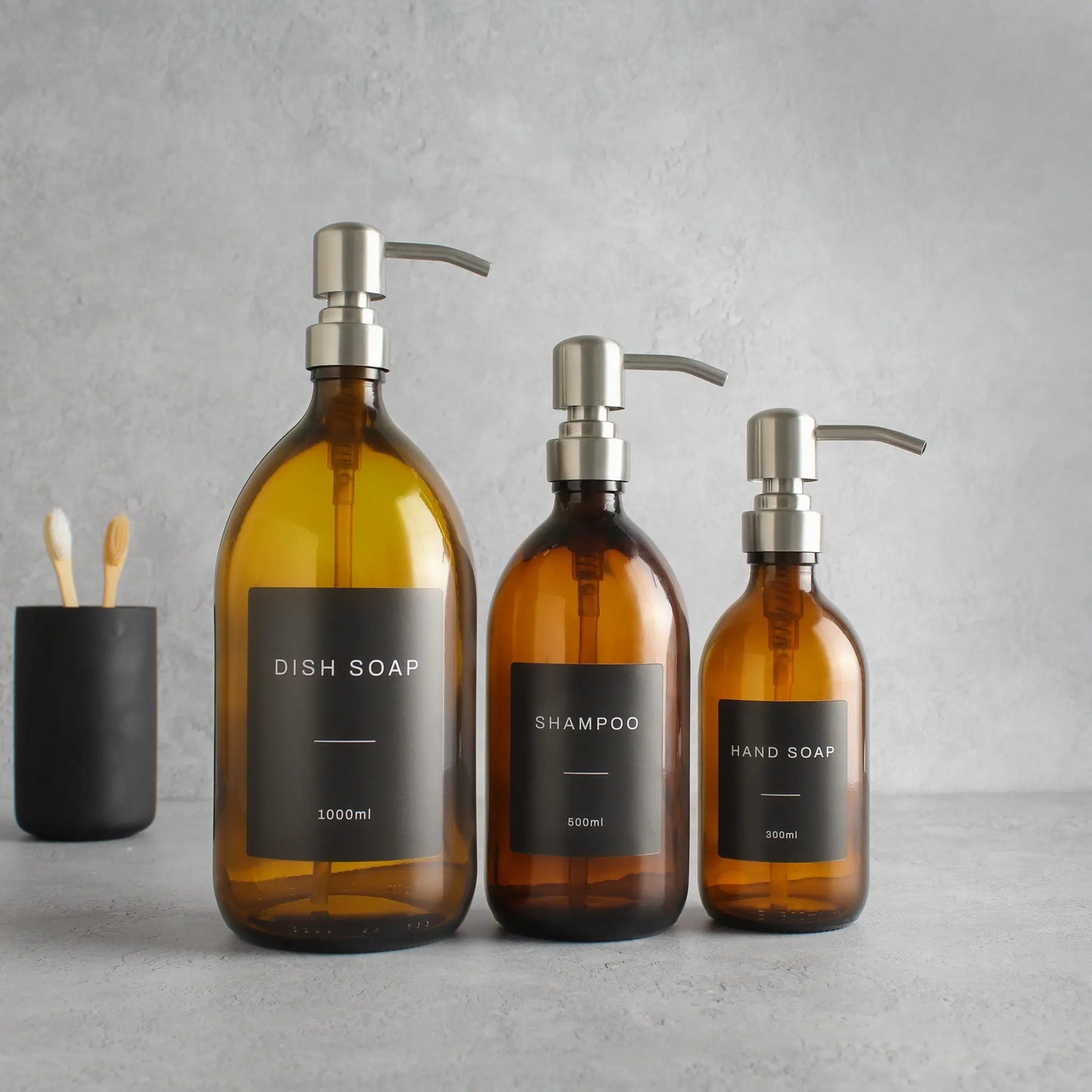 Labelled Amber Glass Dispenser Bottle With Silver Pump Namie Home