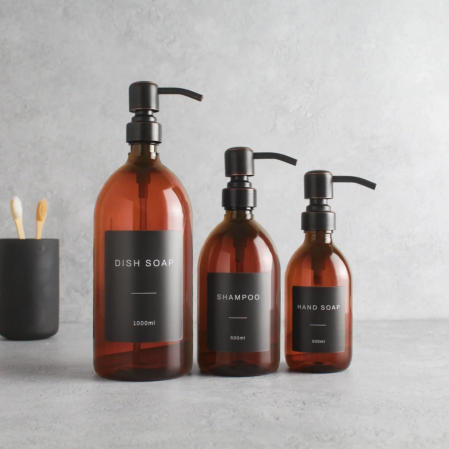 Labelled Amber Plastic Dispenser Bottle With Black/Copper Pump Namie Home
