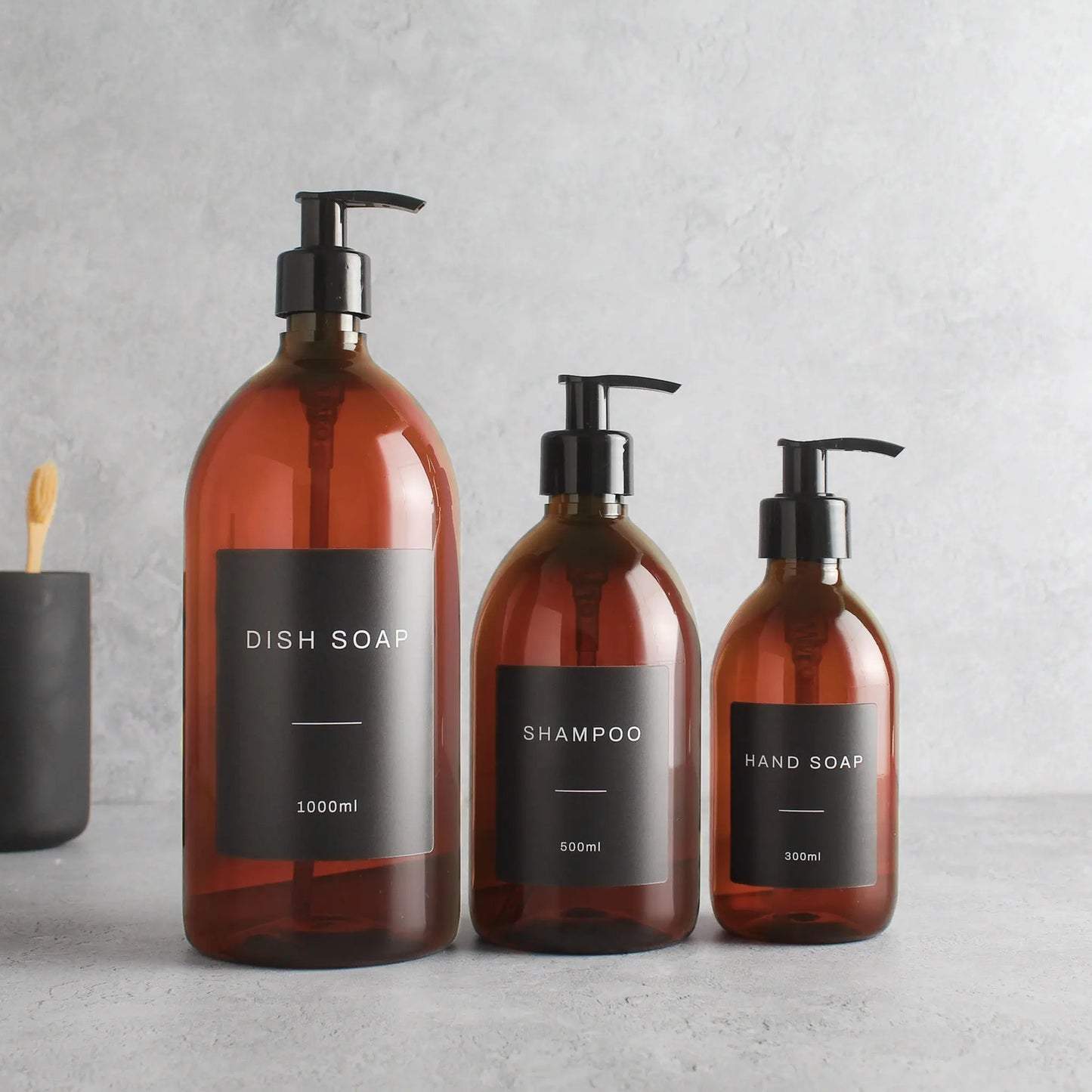 Labelled Amber Plastic Dispenser Bottle With Black Pump Namie Home
