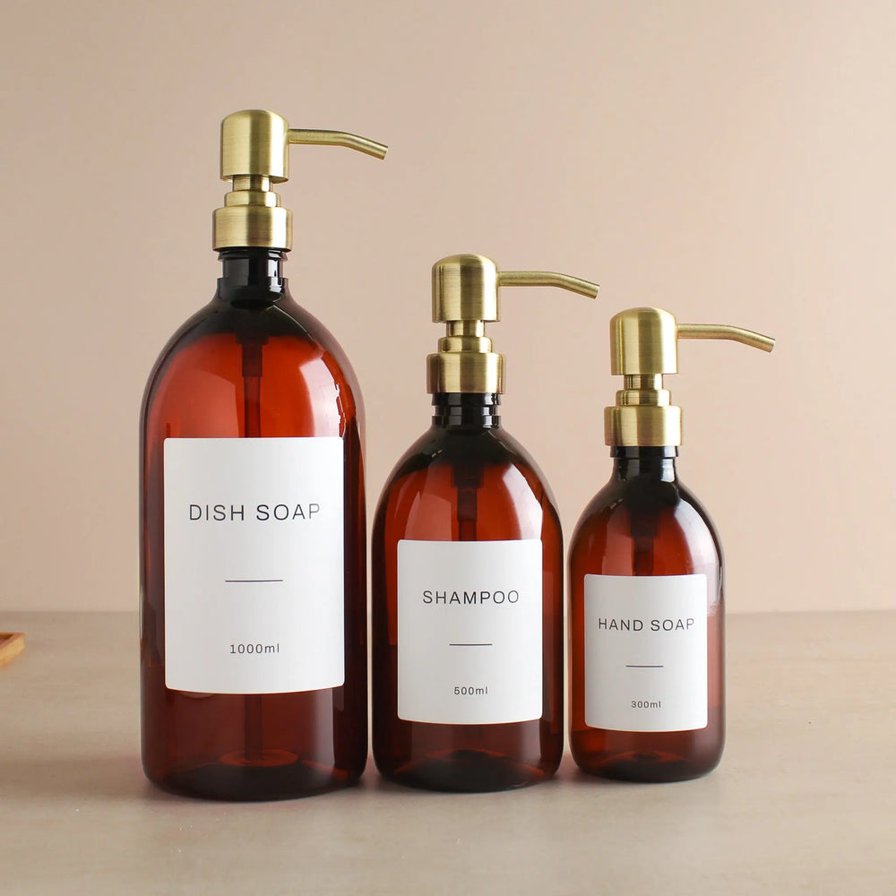 Labelled Amber Plastic Dispenser Bottle With Gold Pump Namie Home