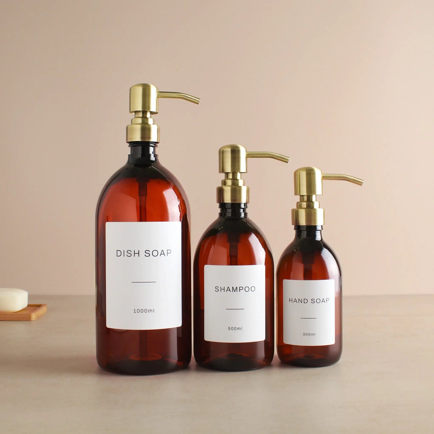 Labelled Amber Plastic Dispenser Bottle With Gold Pump Namie Home
