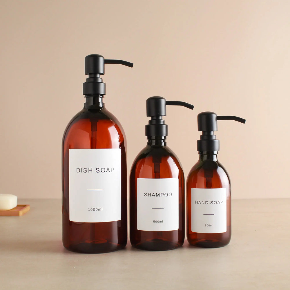 Labelled Amber Plastic Dispenser Bottle With Matte Black Pump Namie Home