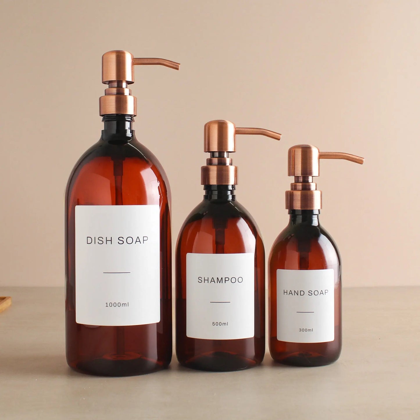 Labelled Amber Plastic Dispenser Bottle With Rose Gold Pump Namie Home