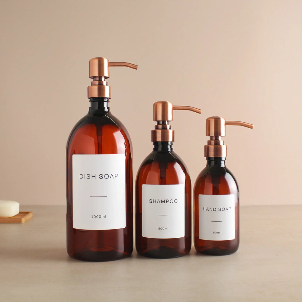 Labelled Amber Plastic Dispenser Bottle With Rose Gold Pump Namie Home