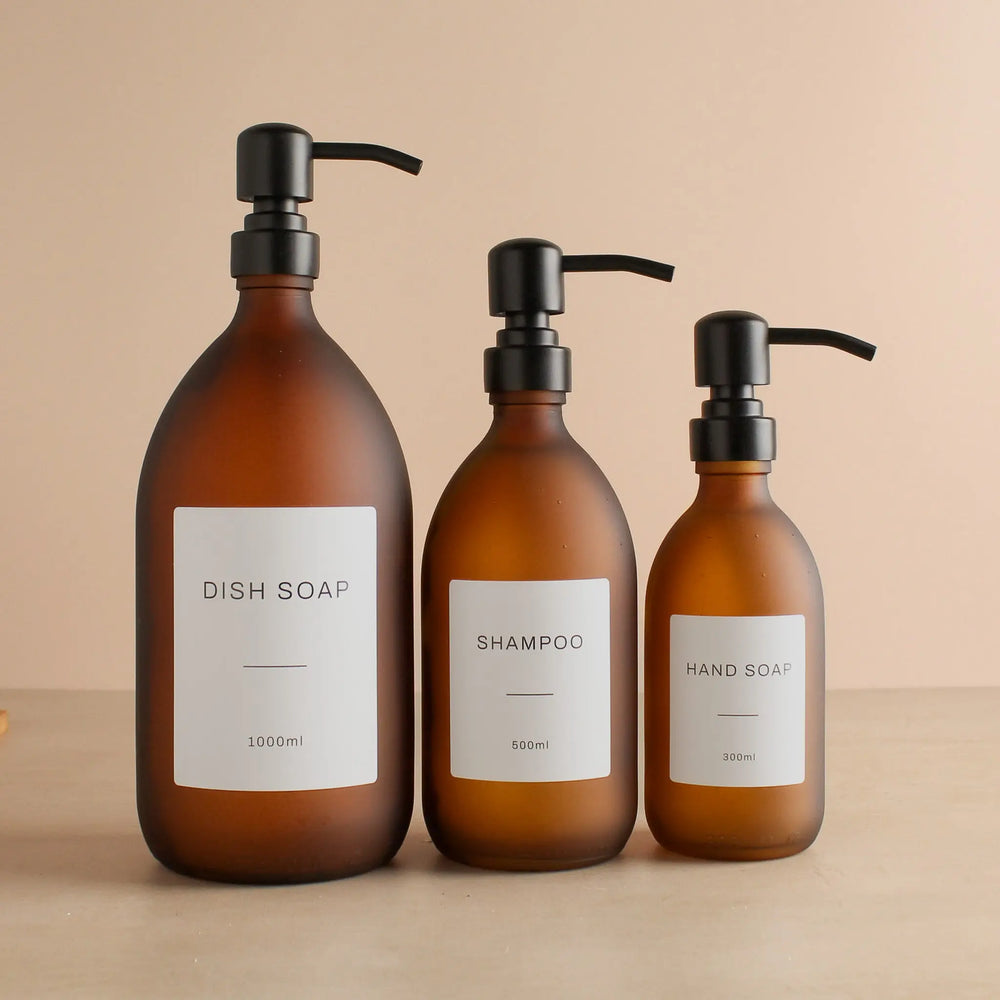 Labelled Frosted Amber Glass Dispenser Bottle With Matte Black Pump Namie Home