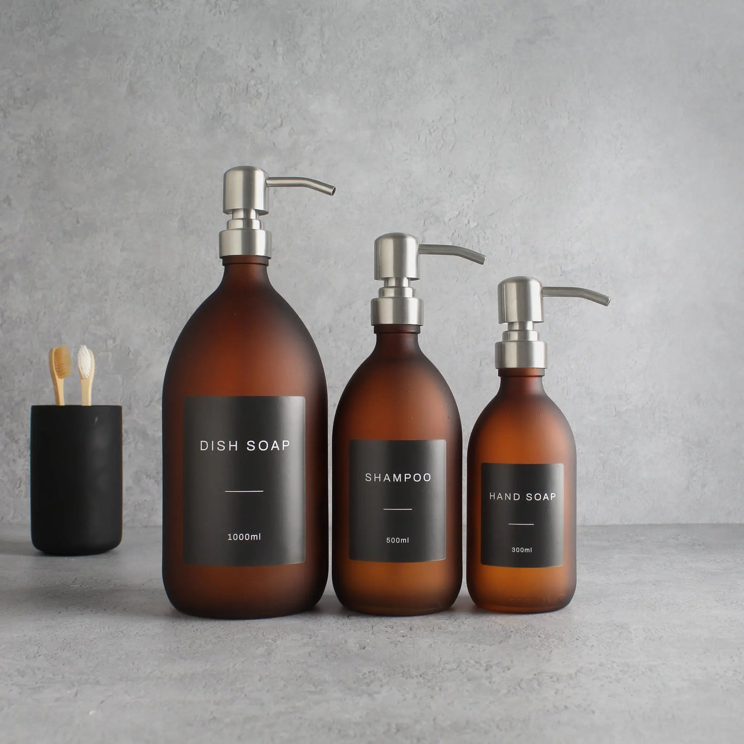 Labelled Frosted Amber Glass Dispenser Bottle With Silver Pump Namie Home