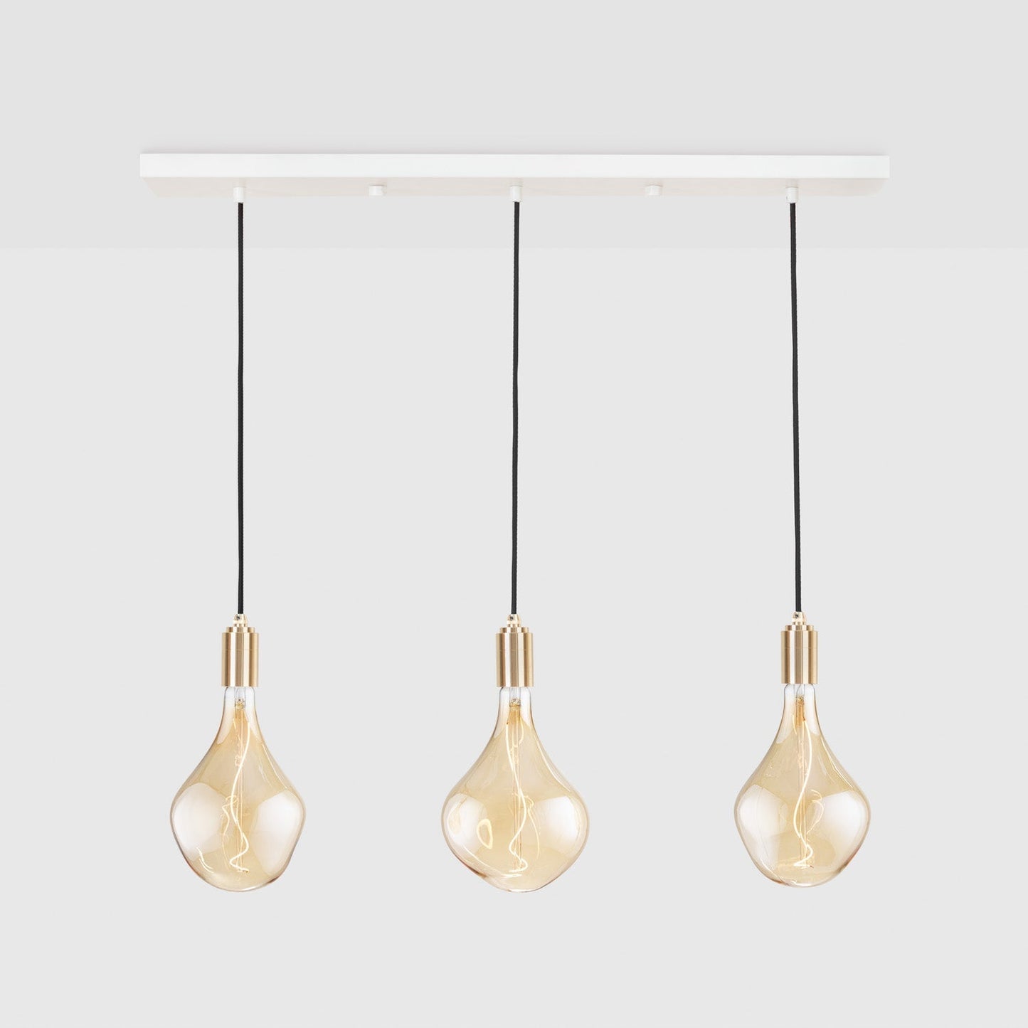 Linear Triple Pendant in Brass + Voronoi II Tala