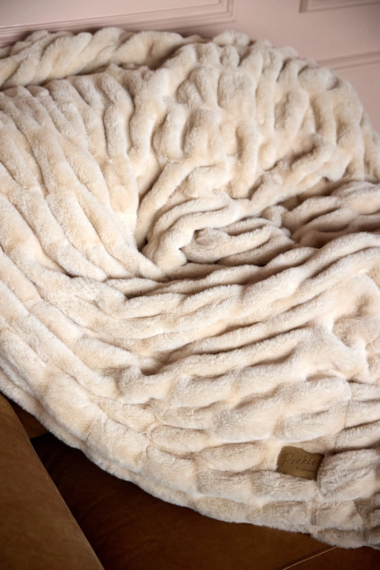 The SnuggleStretch™ Blanket in 'Very Demure' Pookie Originals®