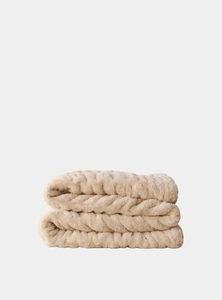 The SnuggleStretch™ Blanket in 'Very Demure' Pookie Originals®