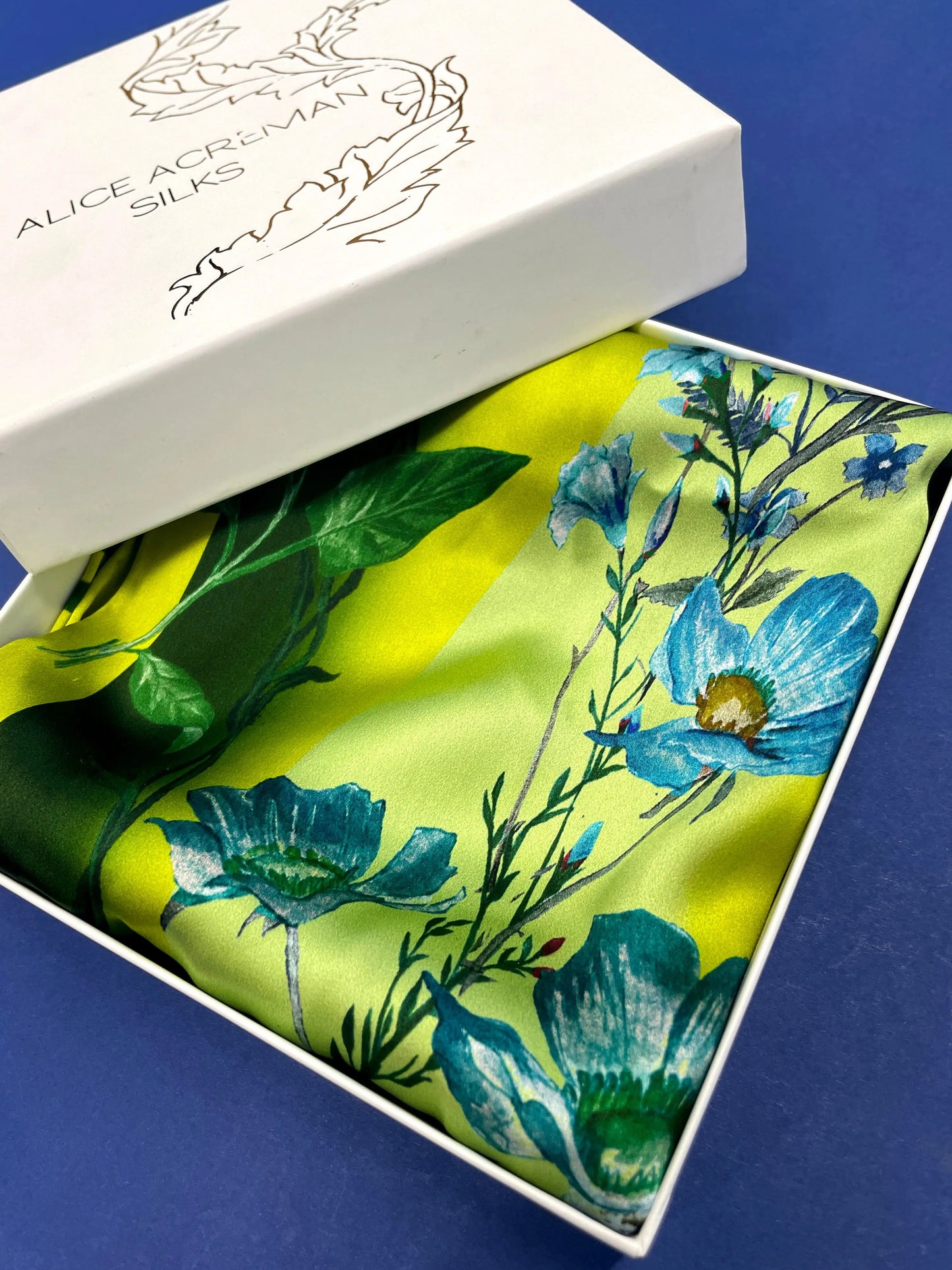 Vibrant yellow and pale blue ‘Luciferin’ floral silk scarf Alice Acreman Silks