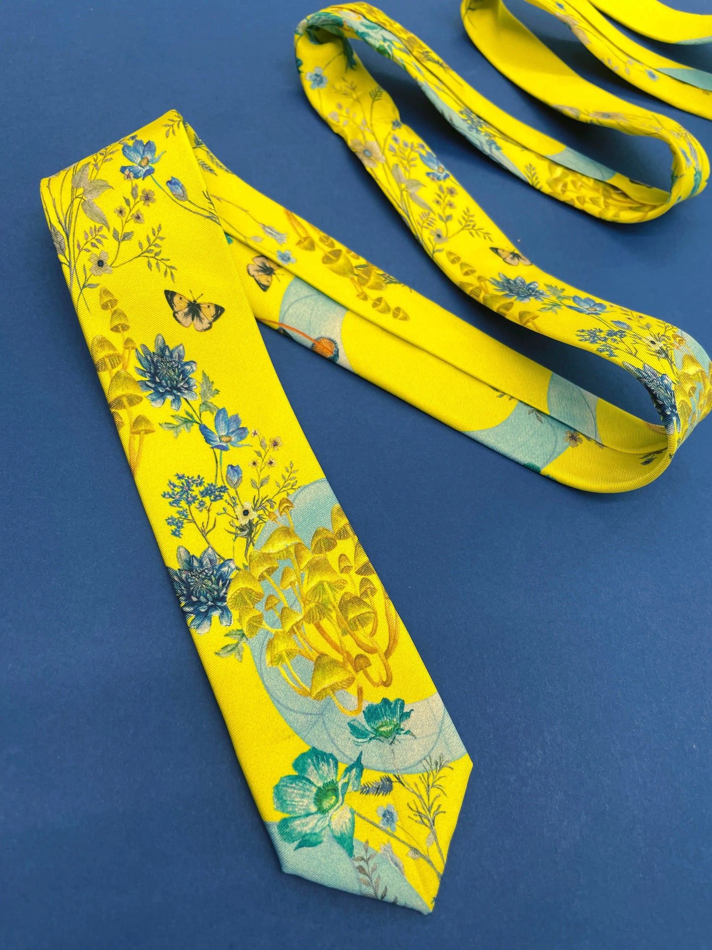 Vibrant yellow and pale blue ‘Luciferin’ floral silk tie Alice Acreman Silks