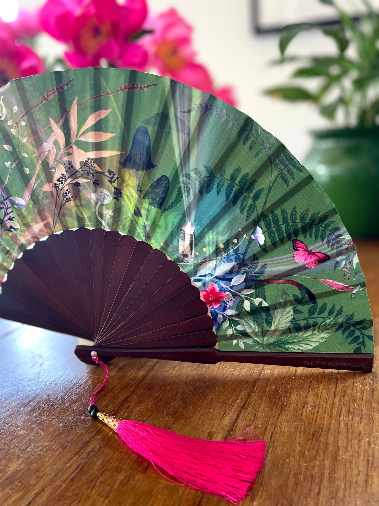 Green hand-held silk fan with 'Greenery' mushroom and crystal botanica ...