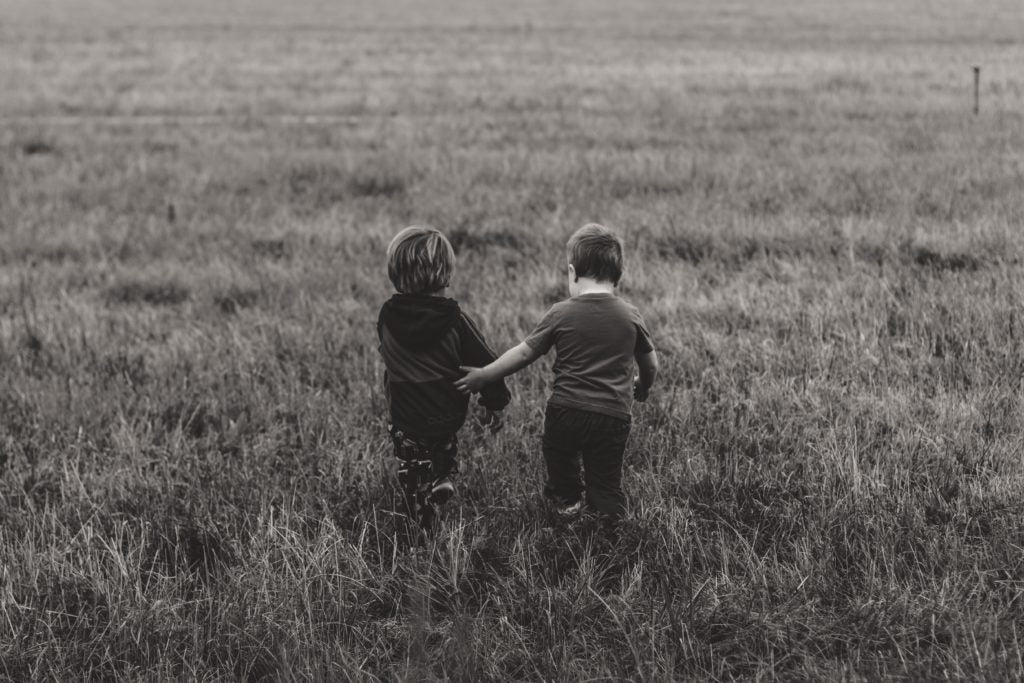 Children running through fields