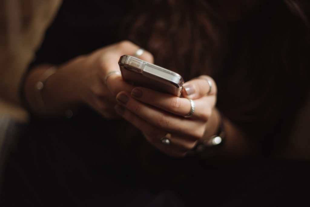 Phones will emit blue light, preventing the production of melatonin, and inhibiting one's ability to sleep.